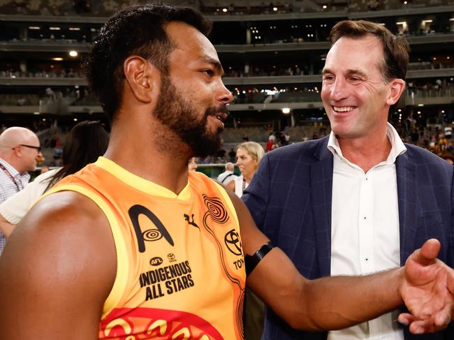 PERTH, AUSTRALIA - FEBRUARY 15: Andrew Dillon, Chief Executive Officer of the AFL speaks with Willie Rioli of the Indigenous All Stars during the 2025 Toyota AFL Indigenous All Stars match between the Indigenous All Stars and the Fremantle Dockers at Optus Stadium on February 15, 2025 in Perth, Australia. (Photo by Dylan Burns/AFL Photos via Getty Images)