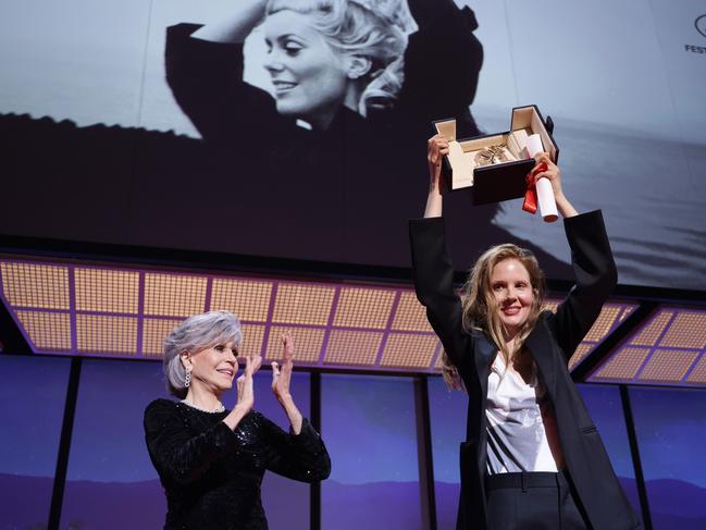 Justine Triet receives The Palme d'Or Award for 'Anatomy of a Fall' from Jane Fonda. Picture: Getty Images