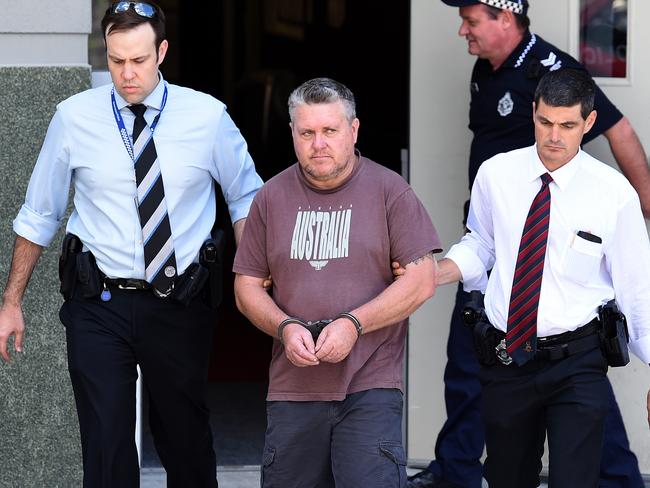 Rick Thorburn being escorted by police from the Logan Central Police Station, Queensland, was sentenced to life in prison for the murder of his 12-year-old foster daughter Tiahleigh Palmer in October 2015. Picture: AAP