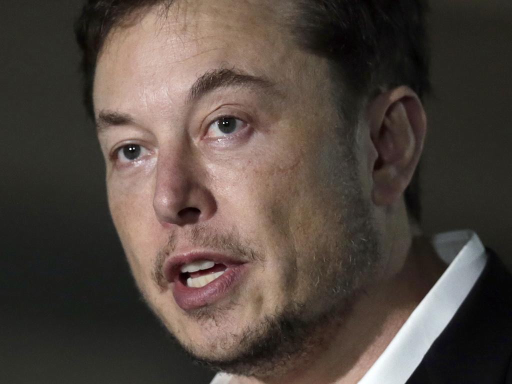 FILE - In this Thursday, June 14, 2018 file photo, Tesla CEO and founder of the Boring Company Elon Musk speaks at a news conference, in Chicago. On Tuesday, July 19, 2018, The Associated Press has found that stories circulating on the internet that Musk announced plans to leave Tesla to start a digital currency company are untrue. (AP Photo/Kiichiro Sato, File)