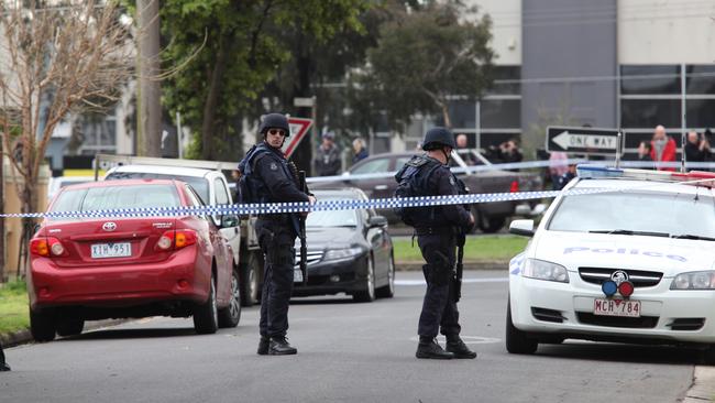 Police at the Brooklyn home where Macchour Chaouk was gunned down in 2010. Picture: David Crosling