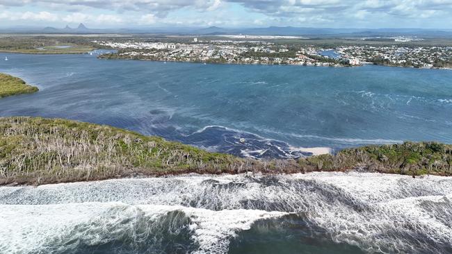 Drone shots attached of the area where water has flowed over Bribie Island and where the next breakthrough could happen. Photos: Shane T Reynolds