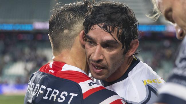 Cooper Cronk and Johnathan Thurston embrace for the final time in their career. (AAP Image/Craig Golding)