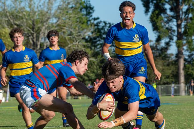 Adam Davis scores a try for TGS. Photo by Nev Madsen