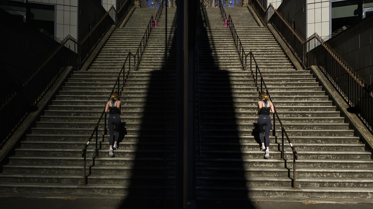 A woman runs the Windmill Stairs at The Rocks. Picture: Darren Roberts