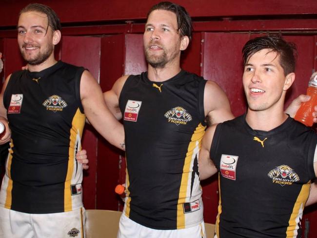 Balwyn players Chevy Anderson, Rod Crowe and Ed Court celebrate the win in the Eastern Football League (EFL). Picture David Woodhouse