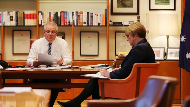 Scott Morrison discusses revelations of the wave of cyber attacks with Defence Minister Linda Reynolds on Friday. Picture: Adam Taylor