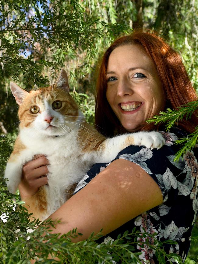 Daisy Ashby with her pet cat Jones, whose night-time roaming was tracked by GPS. Pic: Tricia Watkinson.