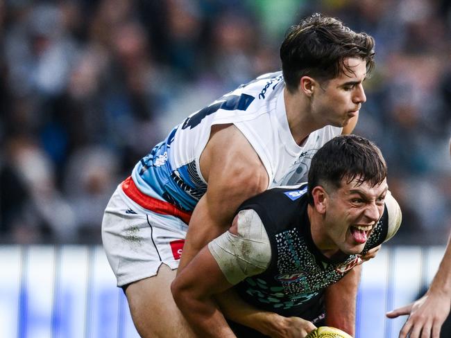 Oisin Mullin hardly gave Zak Butters an inch.