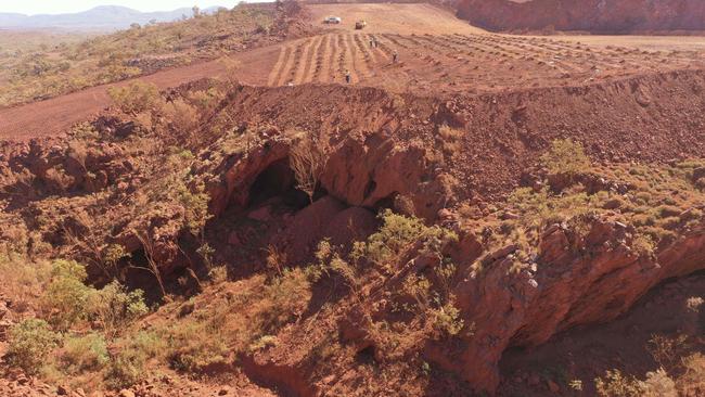 This handout photo taken on May 15, 2020 and released by the PKKP Aboriginal Corporation and received by AFP on May 27, 2020 shows Juukan Gorge in Western Australia -- one of the earliest known sites occupied by Aboriginals in Australia. Photo by Handout / PKKP Aboriginal Corporation / AFP