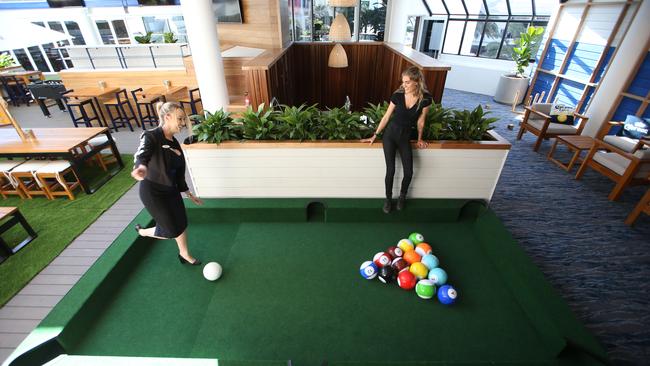 Larissa Burgess and Bonnie Ayres try the life-size game of pool at The Surfers Paradise Beer Garden. Picture: Glenn Hampson