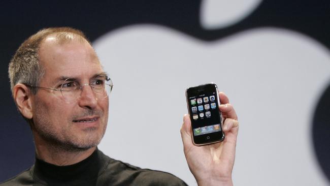 Apple CEO Steve Jobs holds up the first iPhone at an event in January 2007. Pic: AP