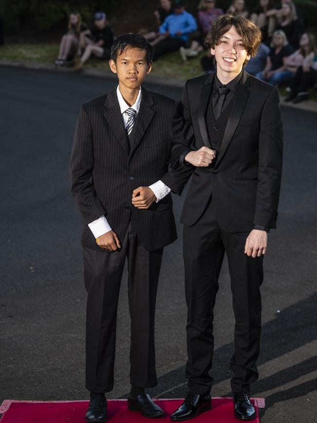 Vijann Horn (left) and Amir Uzbek arrive at Harristown State High School formal at Highfields Cultural Centre, Friday, November 18, 2022. Picture: Kevin Farmer