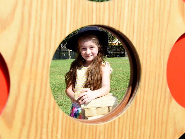 Anastasia Hill (6) at the Darwin Waterfront celebrating the first day of school holidays with giant connect four.