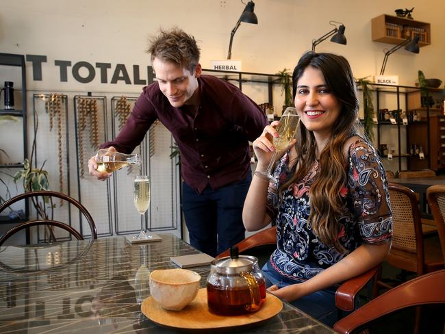 T-totaler co-owner Paul Sunderland pours Sahdia Hamid an Aniseed myrtle sparkling tea. Picture: Toby Zerna