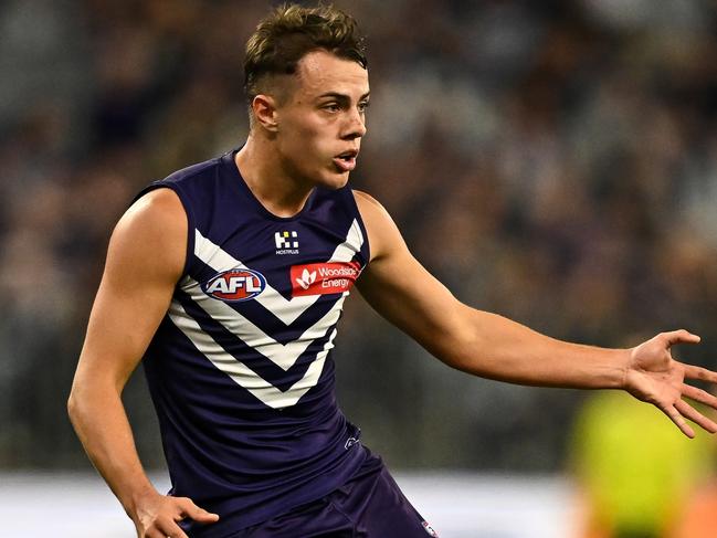 PERTH, AUSTRALIA - APRIL 27: Cooper Simpson of the Dockers kicks the ball during the 2024 AFL Round 07 match between the Fremantle Dockers and the Western Bulldogs at Optus Stadium on April 27, 2024 in Perth, Australia. (Photo by Daniel Carson/AFL Photos via Getty Images)