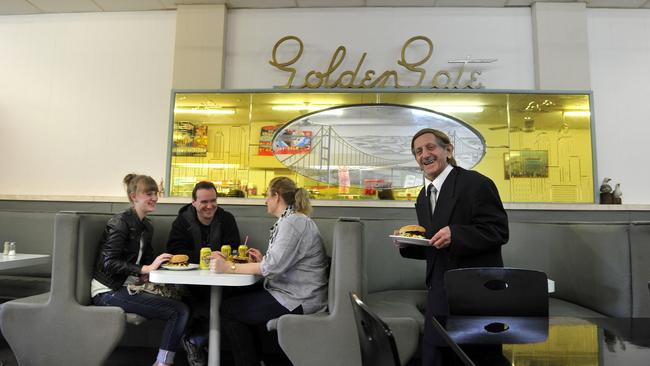 John Adilinis serving customers at The Golden Gate Cafe (Johnny's).