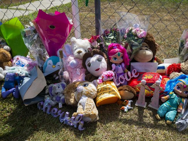 Tributes are seen at a house on Logan Reserve Road, Waterford West inÃÂ Brisbane, Monday, November 25, 2019. The mother of two little girls who died in a hot car parked outside their home is the first person to be charged under Queensland's new definition of murder. (AAP Image/Glenn Hunt) NO ARCHIVING