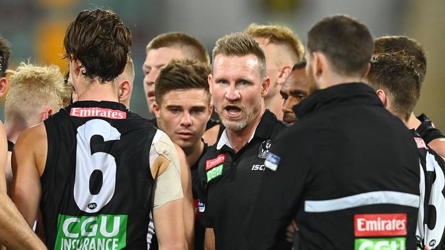 Magpies head coach Nathan Buckley talks to his players during the clash with Port Adelaide.