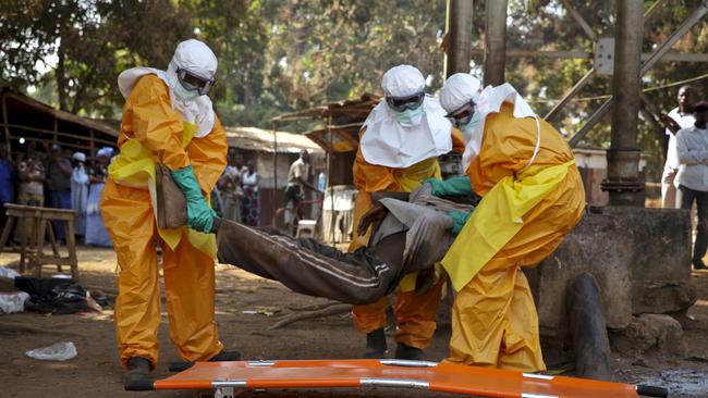 A French Red Cross team picks up a suspected Ebola case from the centre of Forecariah in 2015. Picture: Reuters/Misha Hussain