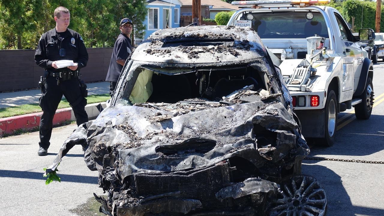 Heche’s wrecked mini is towed away from Walgrove Avenue.. Picture: Backgrid Australia