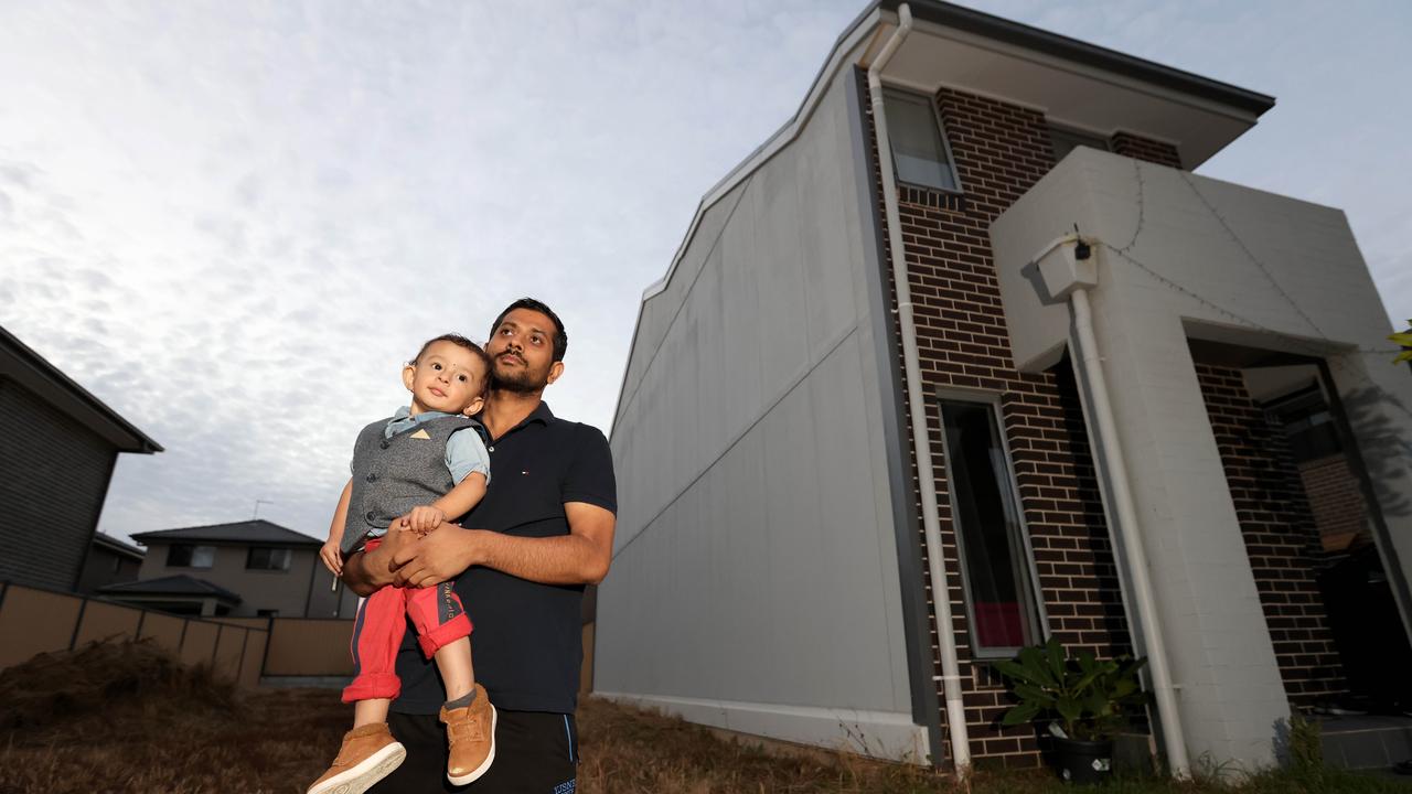 Bishnu Aryal, pictured with his 15-month-old son Branson, says he nearly fainted when he saw his house. Picture: NCA NewsWire/ Damian Shaw