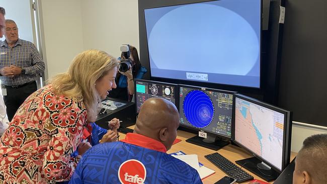 Premier Annastacia Palaszczuk being shown the radar and navigation simulation equipment by members of the Pacific Island patrol boat program in 2023. Photo: Dylan Nicholson