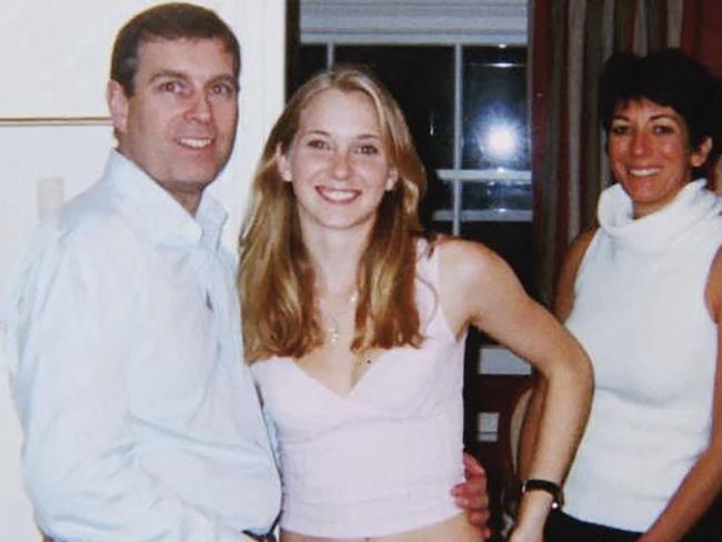 (FILES) In this file undated handout photo taken at an undisclosed location and released on August 9, 2021 by the United States District Couty for the Southern District of New York shows (L-R) Prince Andrew, Virginia Giuffre, and Ghislaine Maxwell posing for a photo. - Disgraced former socialite Ghislaine Maxwell has claimed in a jailhouse interview with a UK broadcaster that a decades-old photograph of Prince Andrew with his arm around his sexual abuse accuser Virginia Giuffre's waist and Maxwell standing next to them -- said to have been taken in London in 2001 -- is "fake". Maxwell, is imprisoned in a Florida penitentiary after her conviction and 20-year sentence for helping late financier Jeffrey Epstein sexually abuse girls. (Photo by Handout / US District Court - Southern District of New York (SDNY) / AFP) / RESTRICTED TO EDITORIAL USE - MANDATORY CREDIT "AFP PHOTO / UNITED STATES DISTRICT COURT FOR THE SOUTHERN DISTRICT OF NEW YORK" - NO MARKETING - NO ADVERTISING CAMPAIGNS - DISTRIBUTED AS A SERVICE TO CLIENTS