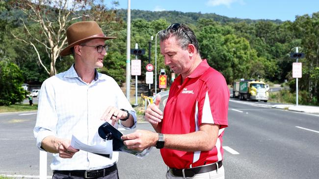 The Queensland and federal governments have committed $265.5 million for roadworks to improve the safety of the Kennedy Highway between Smithfield and Kuranda. Improvements to the road include concrete barriers and guardrails, road widening, additional cameras and a safe turnaround area constructed towards the top of the range. Queensland Transport Minister Bart Mellish and Member for Barron River Craig Crawford look over plans for the improvement of the Kuranda Range Road. Picture: Brendan Radke