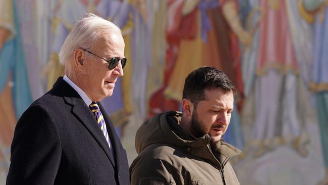 US President Joe Biden (L) walks next to Ukrainian President Volodymyr Zelensky (R) as he arrives for a visit in Kyiv.