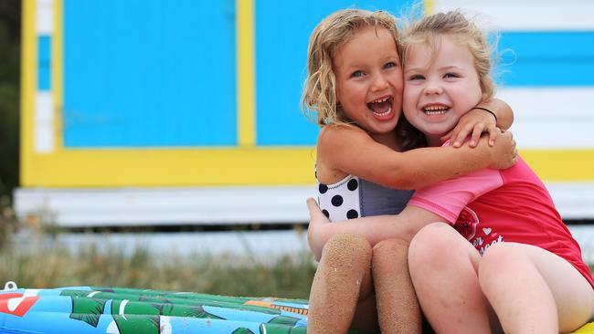 Ivy, 3 and, Amber, 5, at Mt Martha beach boxes.