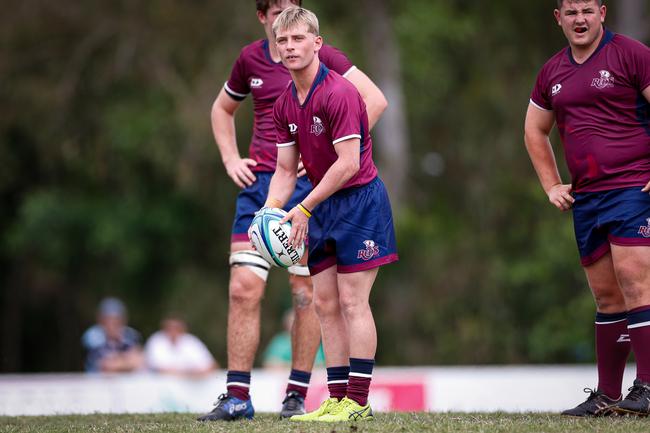 Charlie O'Connell looks to kick for the Reds Under-16s in 2022.