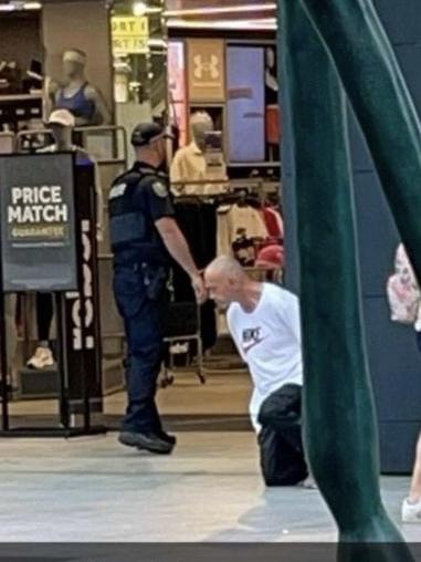 A worker at a nearby Rundle Mall store captured the moment a 45-year-old Bowden man was arrested outside Rebel sport store on Thursday morning. Picture: Supplied