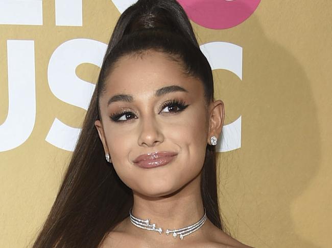 FILE - In this Dec. 6, 2018 file photo, Ariana Grande attends the 13th annual Billboard Women in Music event in New York. Grammys producer Ken Ehrlich says the show had multiple conversations with Grande about performing at the awards show on Sunday but the singer â€œfelt it was too late for her to pull something together.â€ (Photo by Evan Agostini/Invision/AP, File)