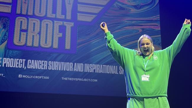 Molly Croft presenting at the Stand Tall event in front of 10,000 people and 90,000 on livestream. Photo: Supplied