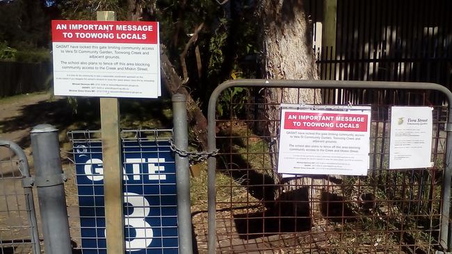 Signs warning locals about plans to fence off the QASMT oval.