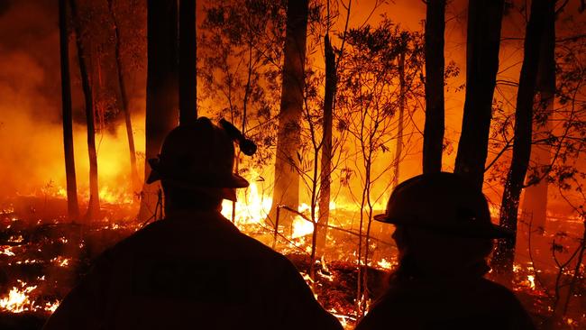 Fire crews monitor back burns between the towns of Orbost and Lakes Entrance in east Gippsland, Victoria, last week. Picture: Getty Images