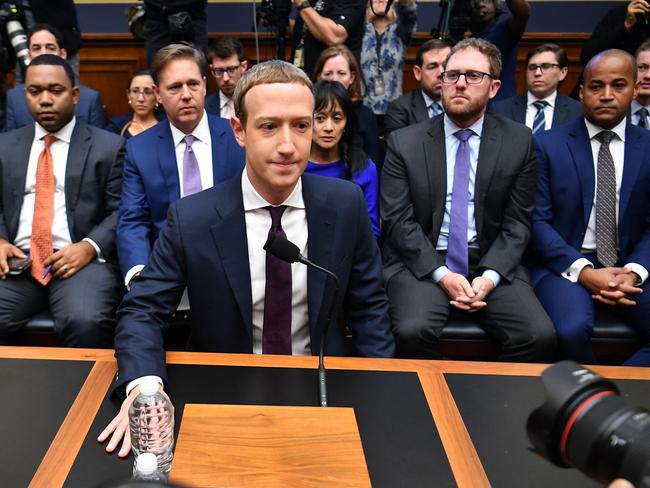 TOPSHOT - Facebook Chairman and CEO Mark Zuckerberg arrives to testify before the House Financial Services Committee on "An Examination of Facebook and Its Impact on the Financial Services and Housing Sectors" in the Rayburn House Office Building in Washington, DC on October 23, 2019. (Photo by MANDEL NGAN / AFP)