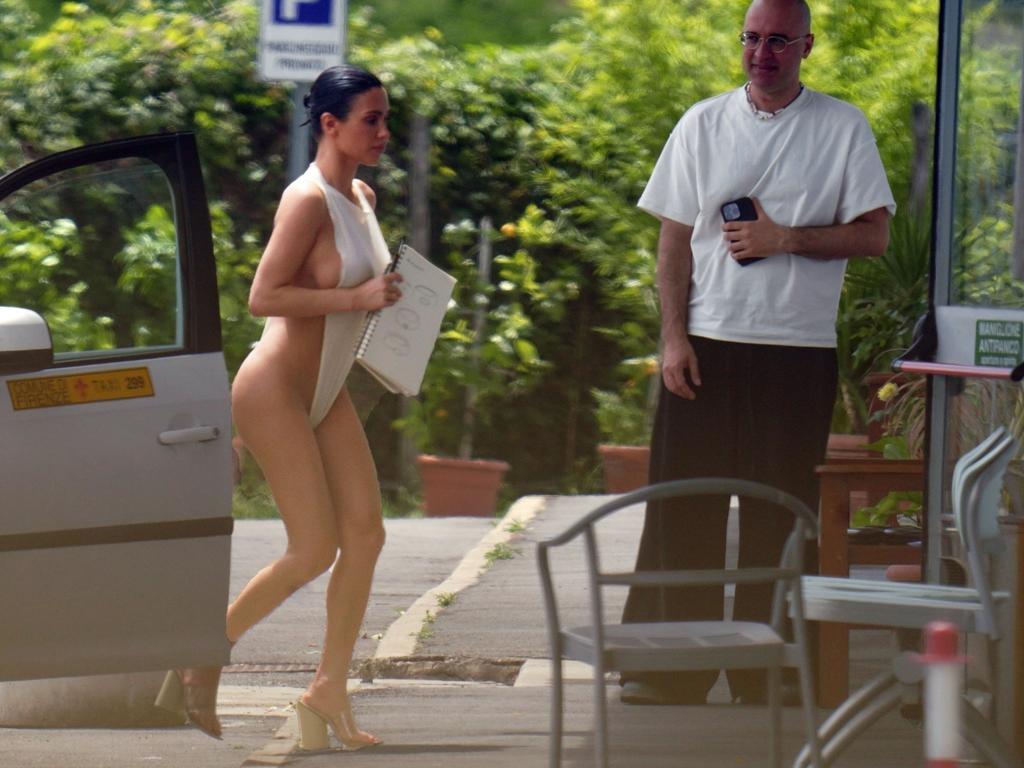 Censori was seen holding sketches of designs as she headed to a meeting with Kanye West. Picture: Focus Tuscany / BACKGRID