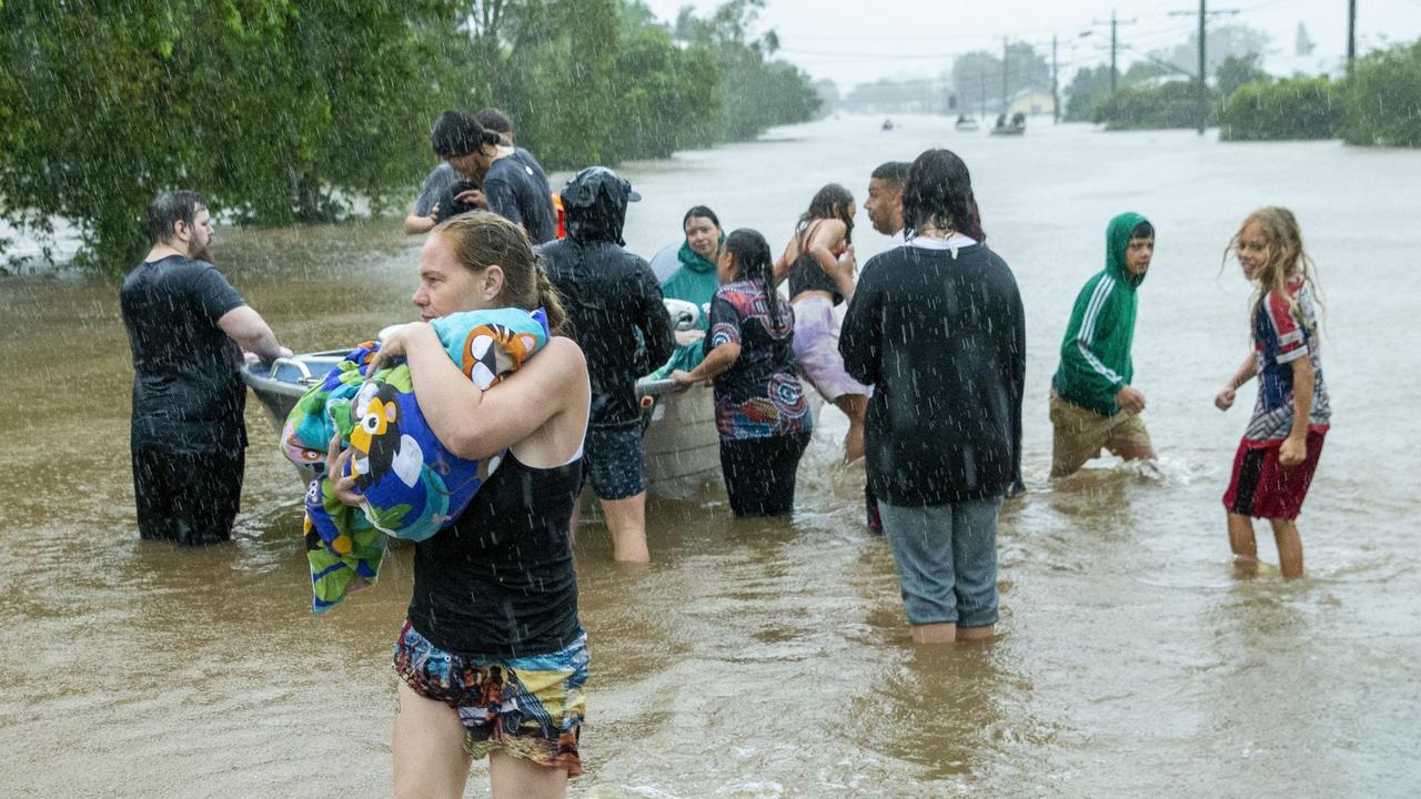 Neighbours help rescue residents and pets on Ballina Road. Picture: Media Mode.