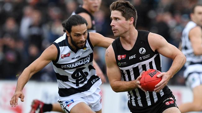 Flying ... Port Adelaide's Steven Summerton takes on South’s Matthew Rankine. Picture: Tom Huntley