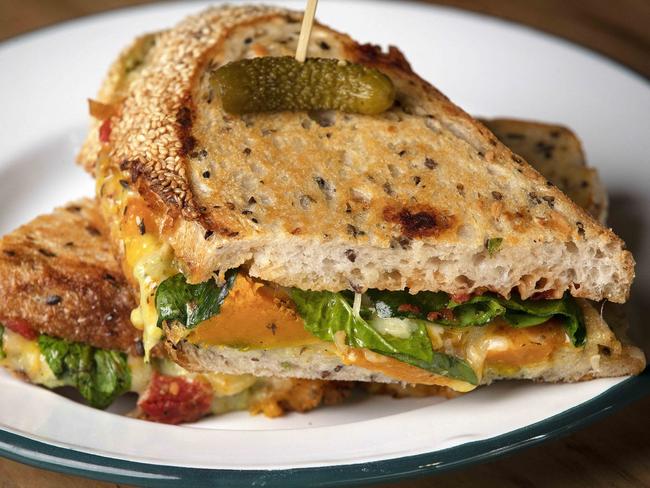 Stabla’s roasted pumpkin toastie which includes well-roasted chunks of pumpkin dotted over thick slices of Pigeon Whole sourdough and topped with Ashgrove cheddar, red onion, herbed mayonnaise and house relish. Picture: Chris Kidd