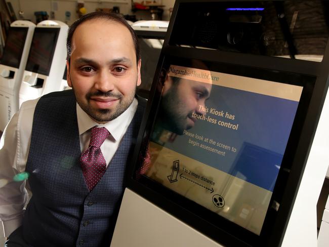 Aaron Hornlimann, CEO of Elenium Automation, with one of the company’s new touchless check-in scanning machines, which also checks your body temperature. Picture: Stuart McEvoy