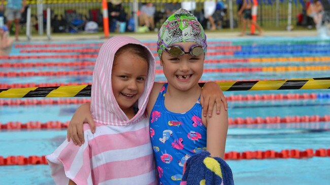 Cannonvale Cannons swimmers Evie Doherty and Koa Harland at the GBR Swimming Carnival in Mackay. Photo: Contributed