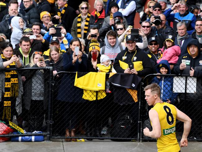 Tiger fans watch Jack Riewoldt during the team's training session on Thursday. Picture: AAP/Joe Castro