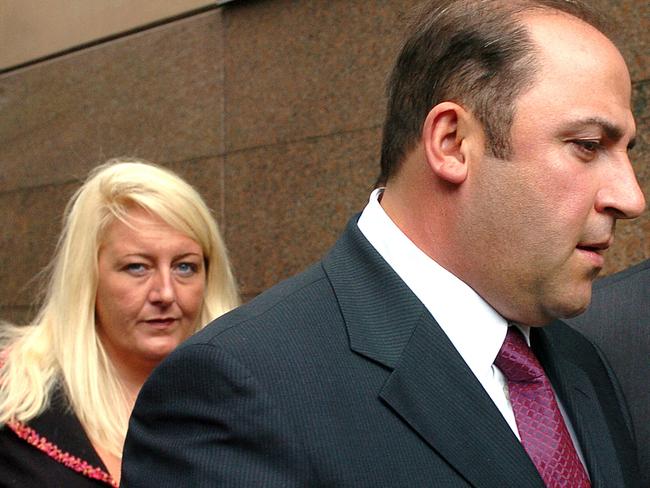 15 Nov 2004 : Gangland boss, Tony Mokbel with his legal team Nicola Gobbo (left) and Con Heliotis QC (right) outside the Magistrates Court - crime Vic drugs headshot mobile phone profile