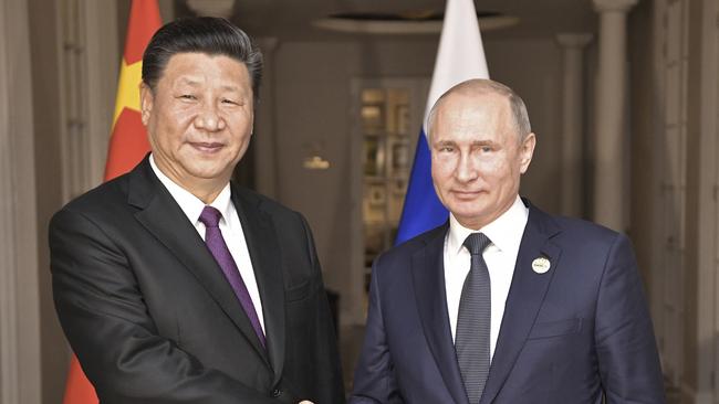 China's President Xi Jinping with Russia's President Vladimir Putin at the BRICS summit in Johannesburg, South Africa. Picture: AP