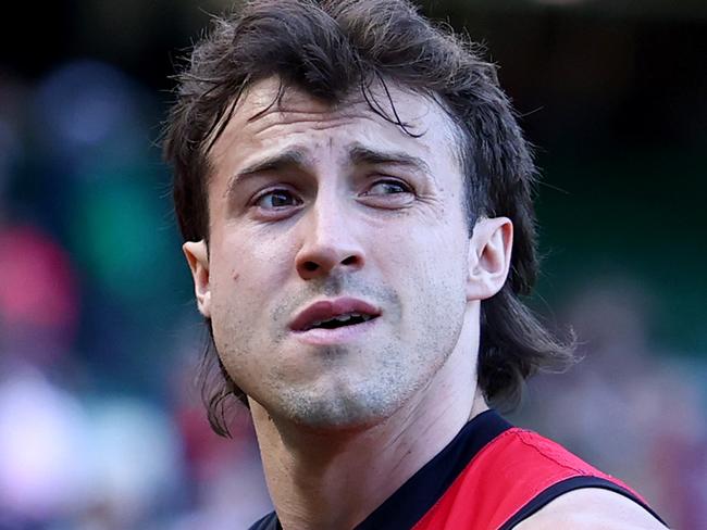 MELBOURNE, AUSTRALIA - MARCH 22: Andrew McGrath of the Bombers looks dejected after losing the round two AFL match between Essendon Bombers and Adelaide Crows at Melbourne Cricket Ground, on March 22, 2025, in Melbourne, Australia. (Photo by Josh Chadwick/AFL Photos/via Getty Images)