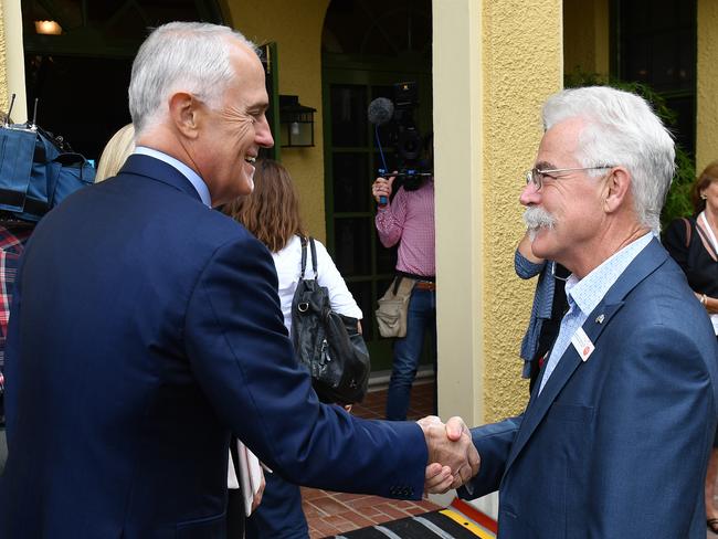 Prime Minister Malcolm Turnbull greets Queensland 2017 Australian of the Year Emeritus Professor Alan Mackay-Sim at the awards ceremony in Canberra. Picture: Mick Tsikas/AAP