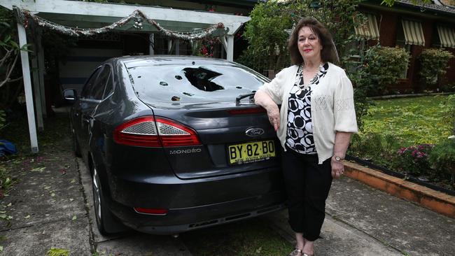 Judith Farrell outside her Berowra property with her hail damaged car in December 2018. Picture: Britta Campion/The Australian